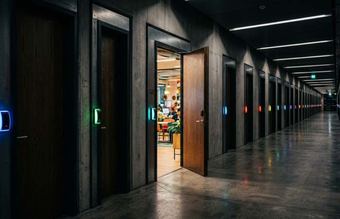 Chain link made of glowing code with one red cracked link